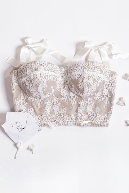 Bustier bianco in pizzo con spalline a fiocco